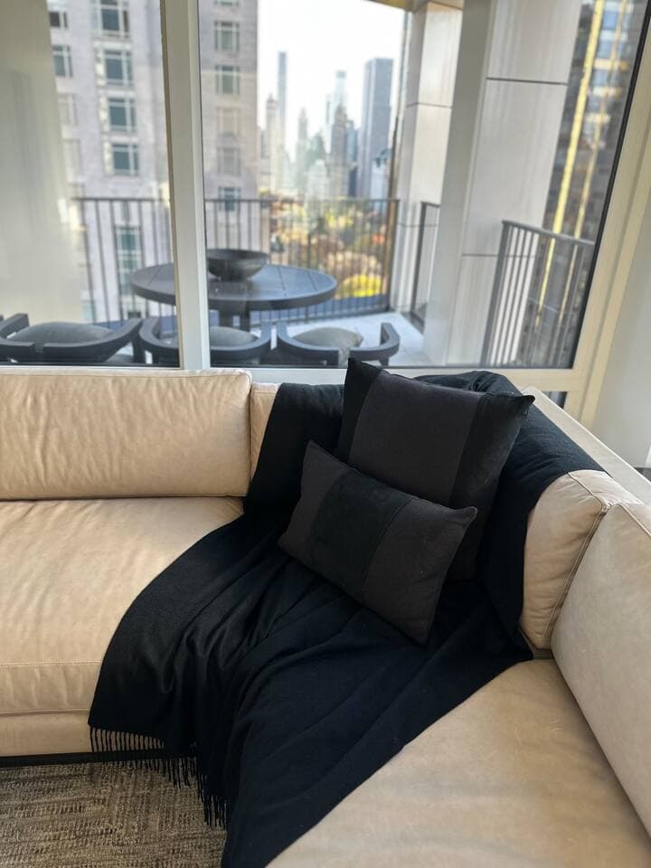 Enjoy the comfort of the leather sofa while enjoying a movie or views of central park