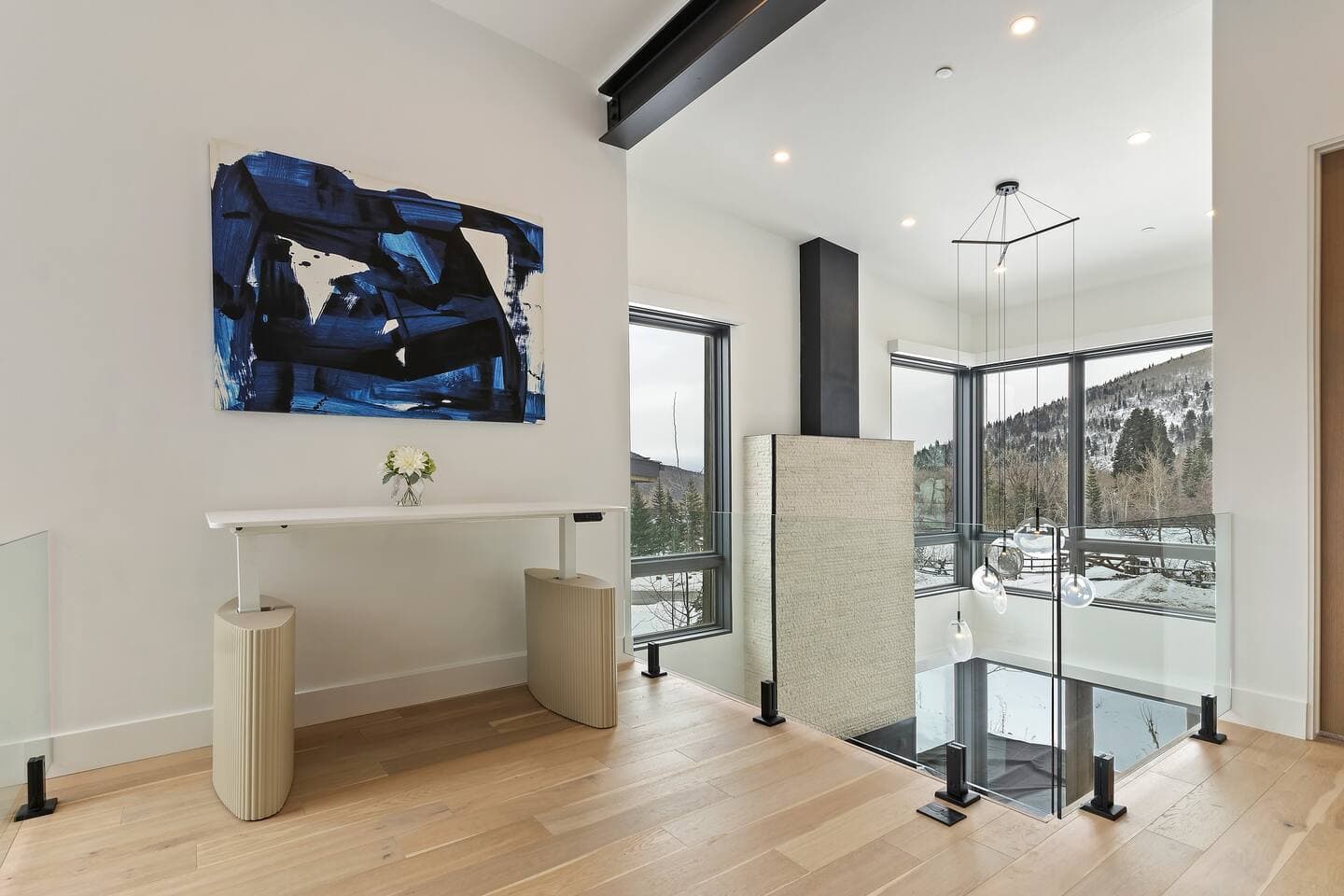 Loft located on 3rd level with a standing desk and mountain views